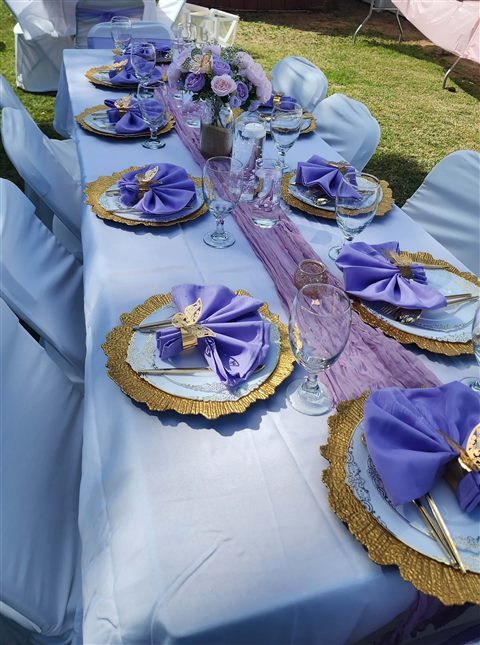 Celebration tablescape with layered textures and floral accents